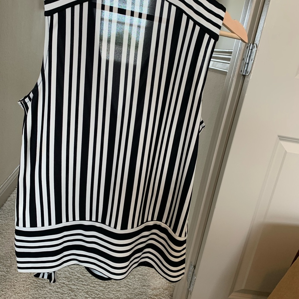 Blouse with a tie on the lower left side